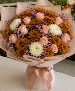 Blooms & Gifts Abouquet of brown and gold