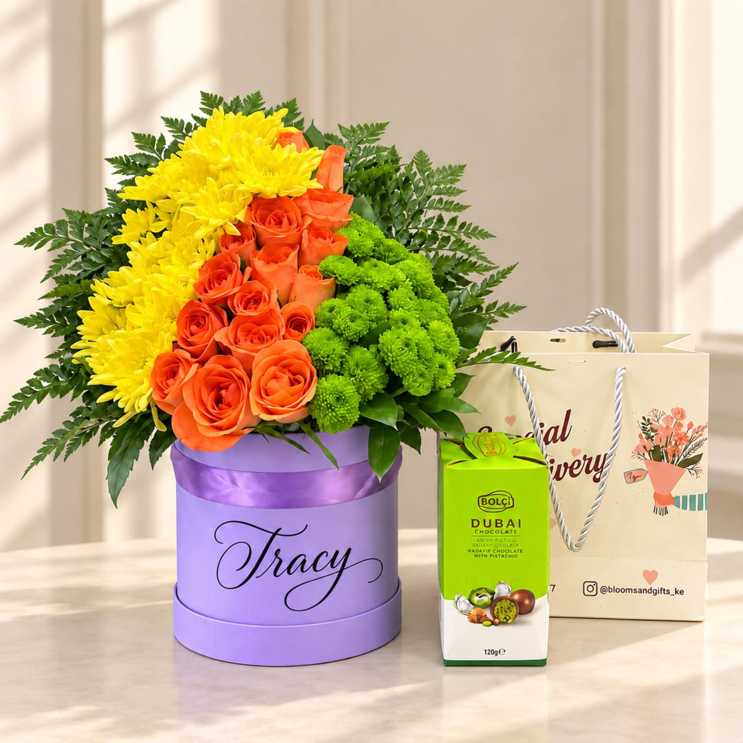 Blooms & Gifts Tropical Burst Orange Rose, Yellow Mum & Dubai Chocolate Round Box