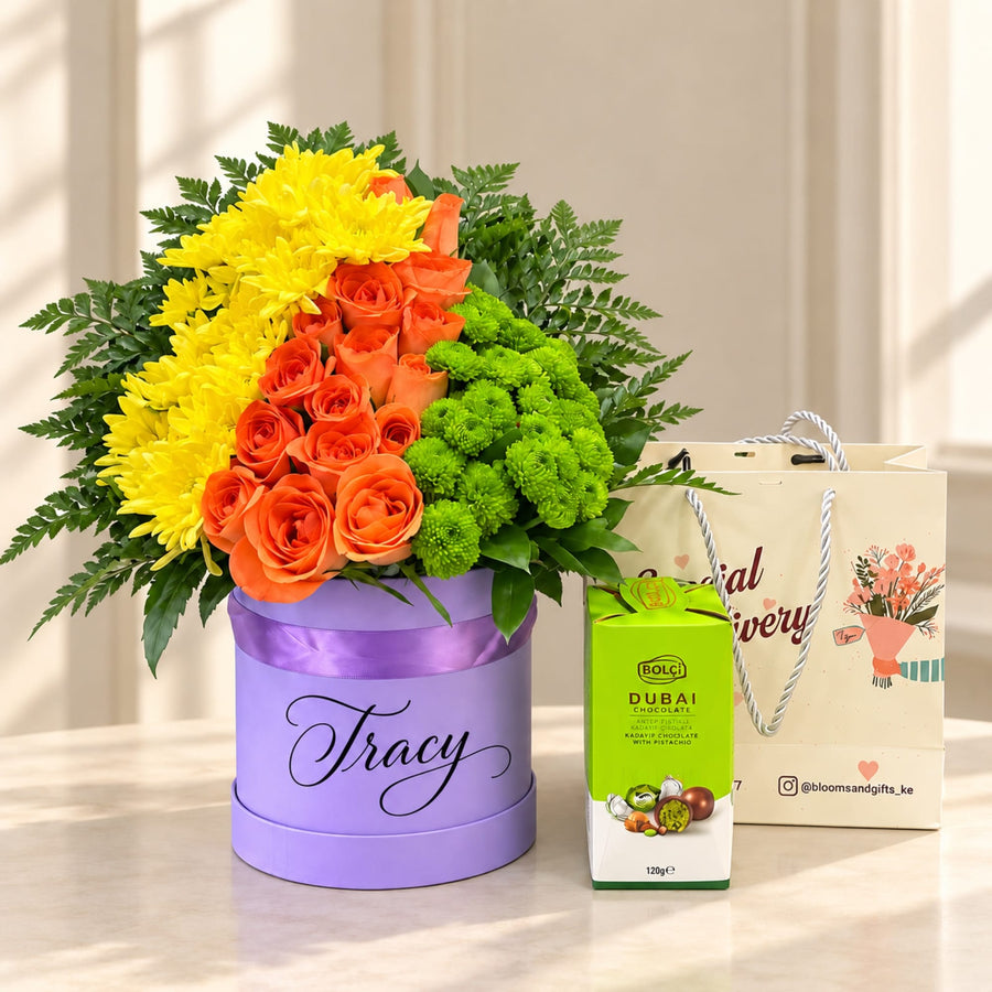 Blooms & Gifts Tropical Burst Orange Rose, Yellow Mum & Dubai Chocolate Round Box